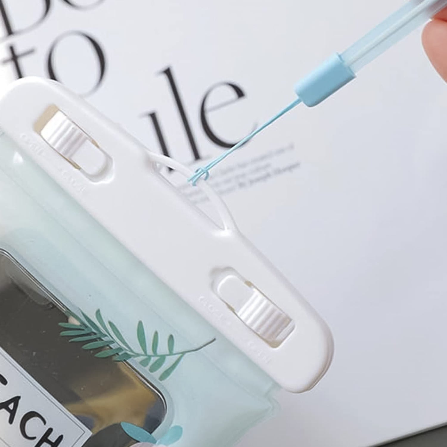 Clear front of waterproof mobile pouch allowing full touchscreen access