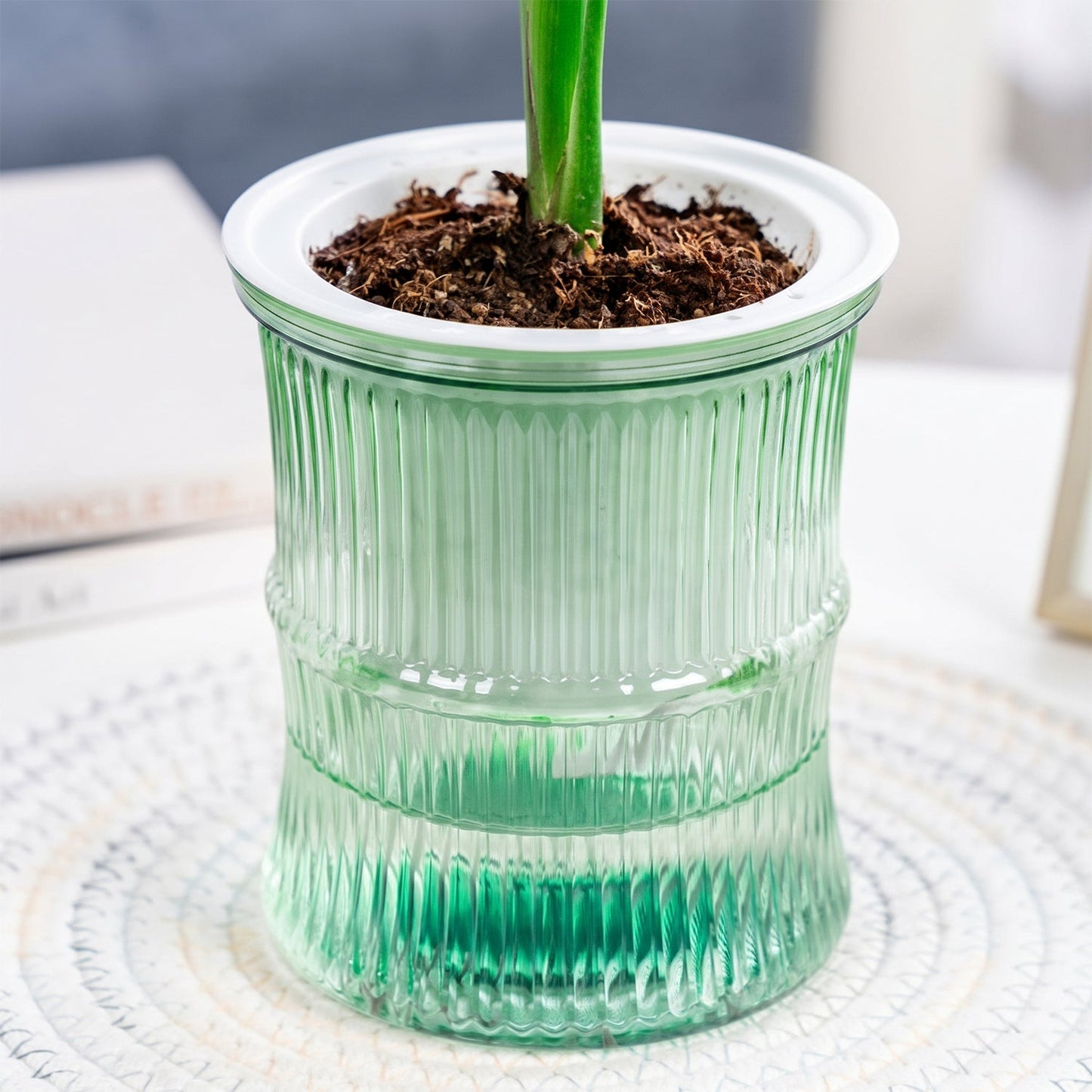 Side view of bamboo-style self-watering planter pot