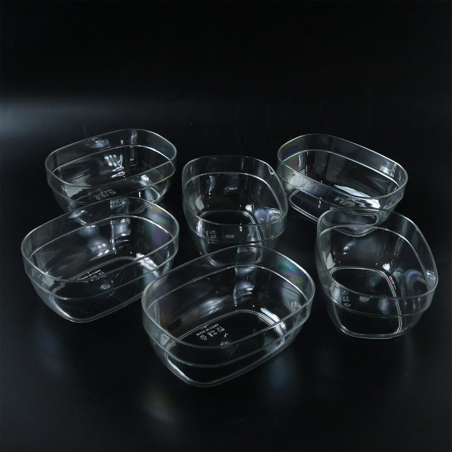 Oval clear serving bowls in use for presenting fresh salads
