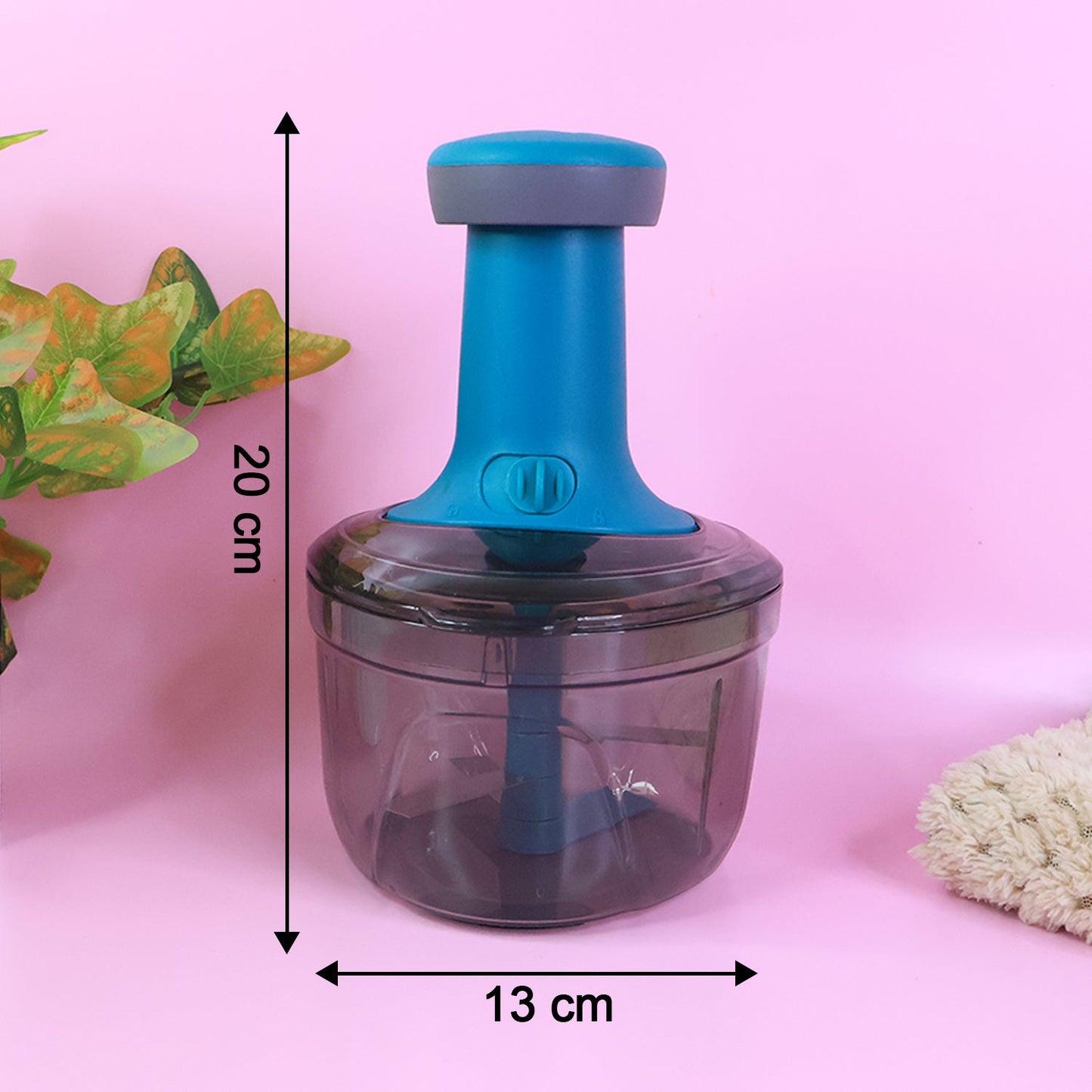 Compact design of manual push chopper vegetable cutter for kitchens.