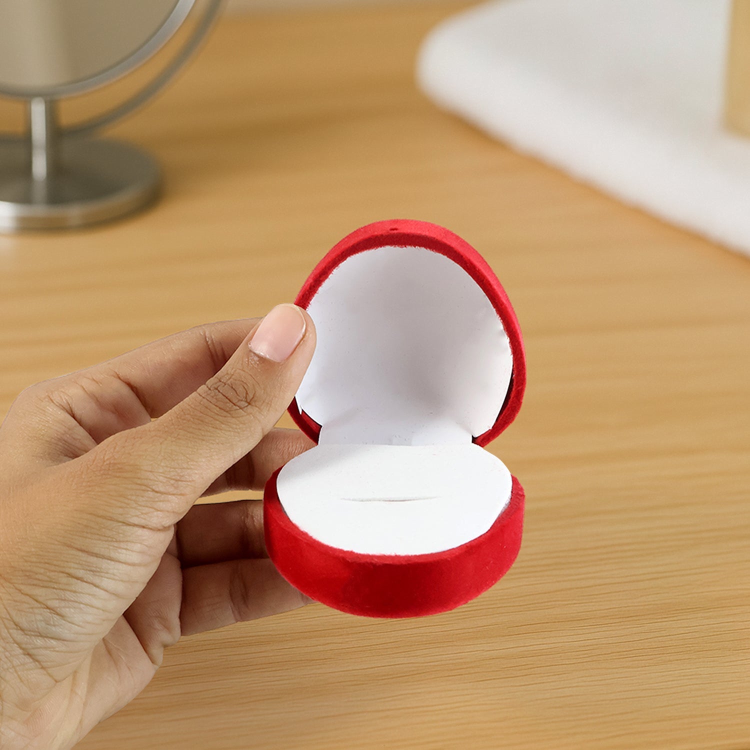 Side view of heart-shaped jewellery ring box with plush velvet finish