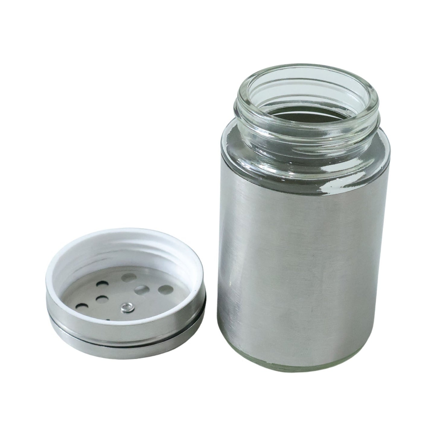 Close-up of stainless steel spice dispenser with sprinkle and pour openings