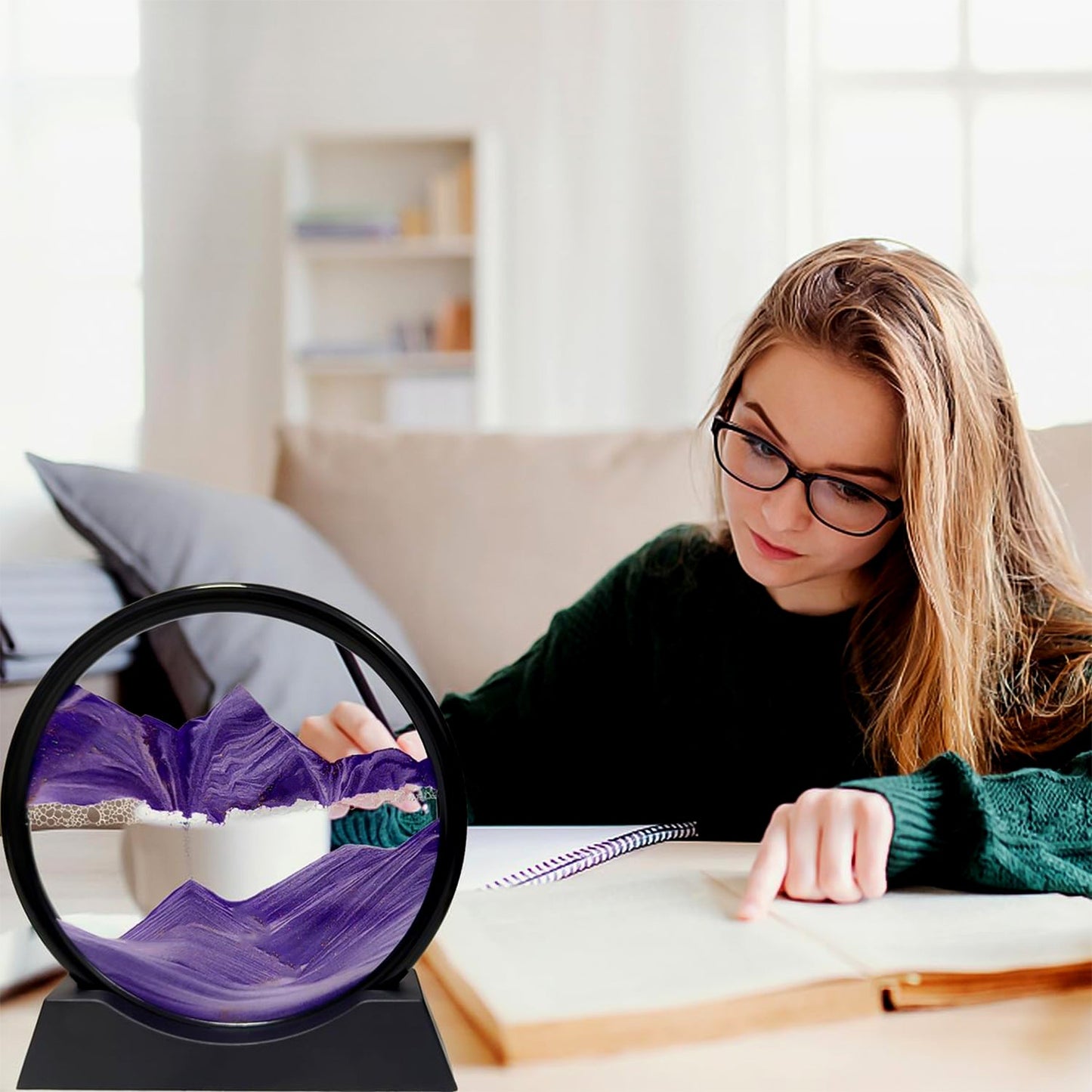 Styleva 3D Moving Sand Art with its round frame, placed on a clean white desk surface.