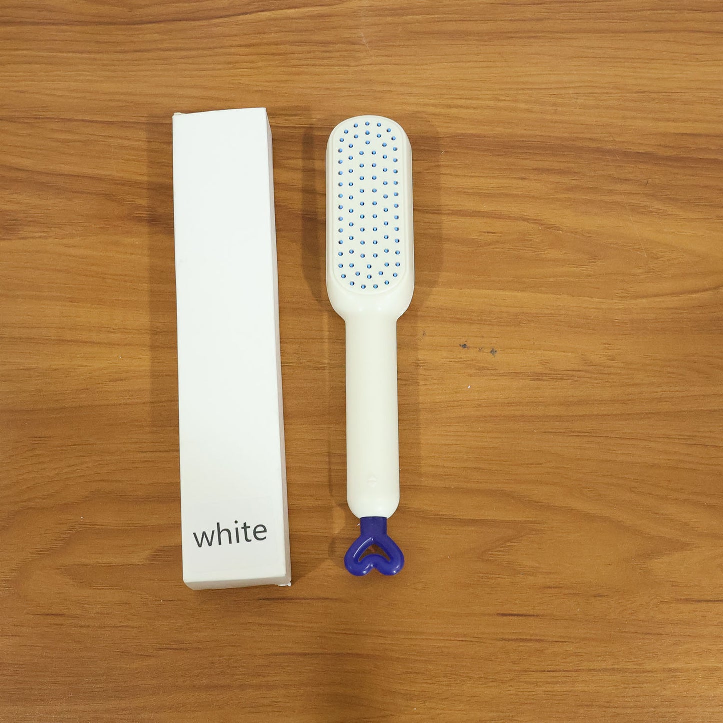 The Self-Cleaning Hairbrush removing trapped hair instantly after use