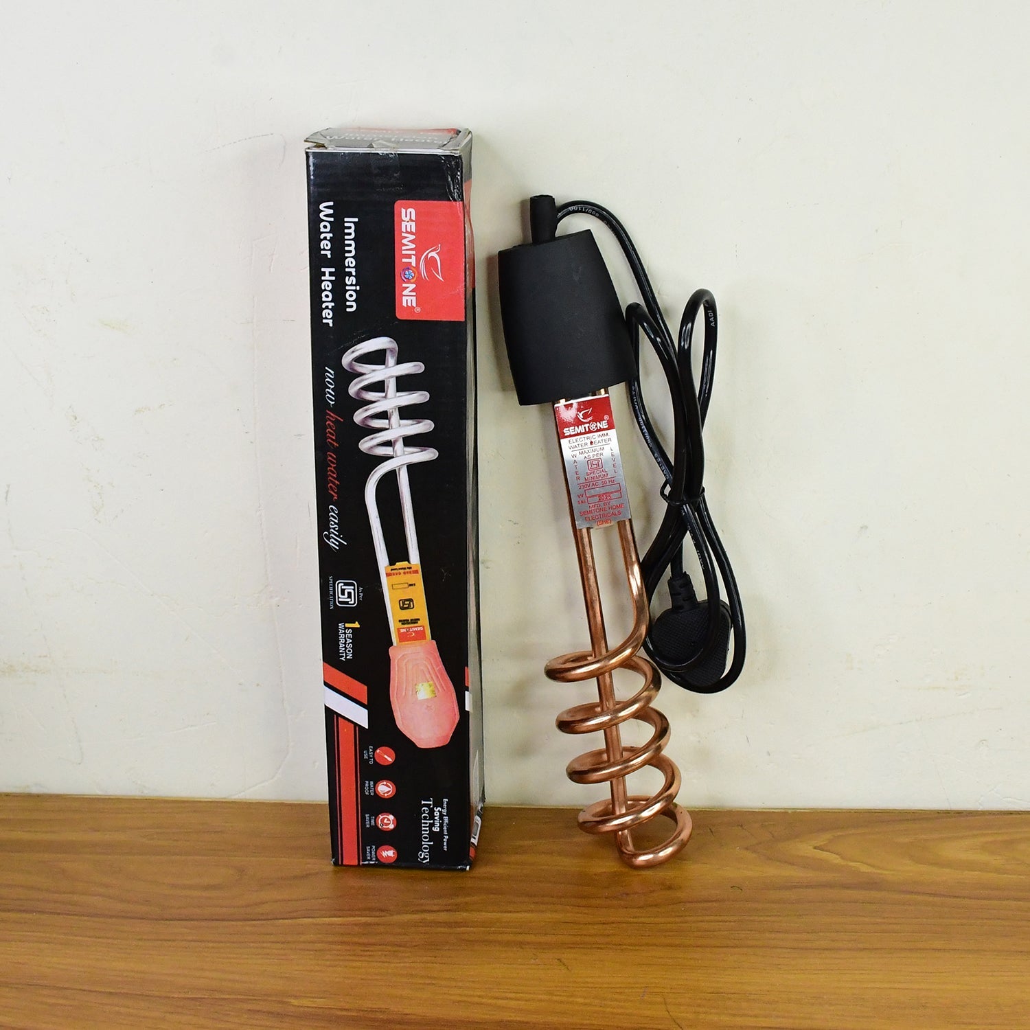 Immersion water heater rod in use heating bucket water