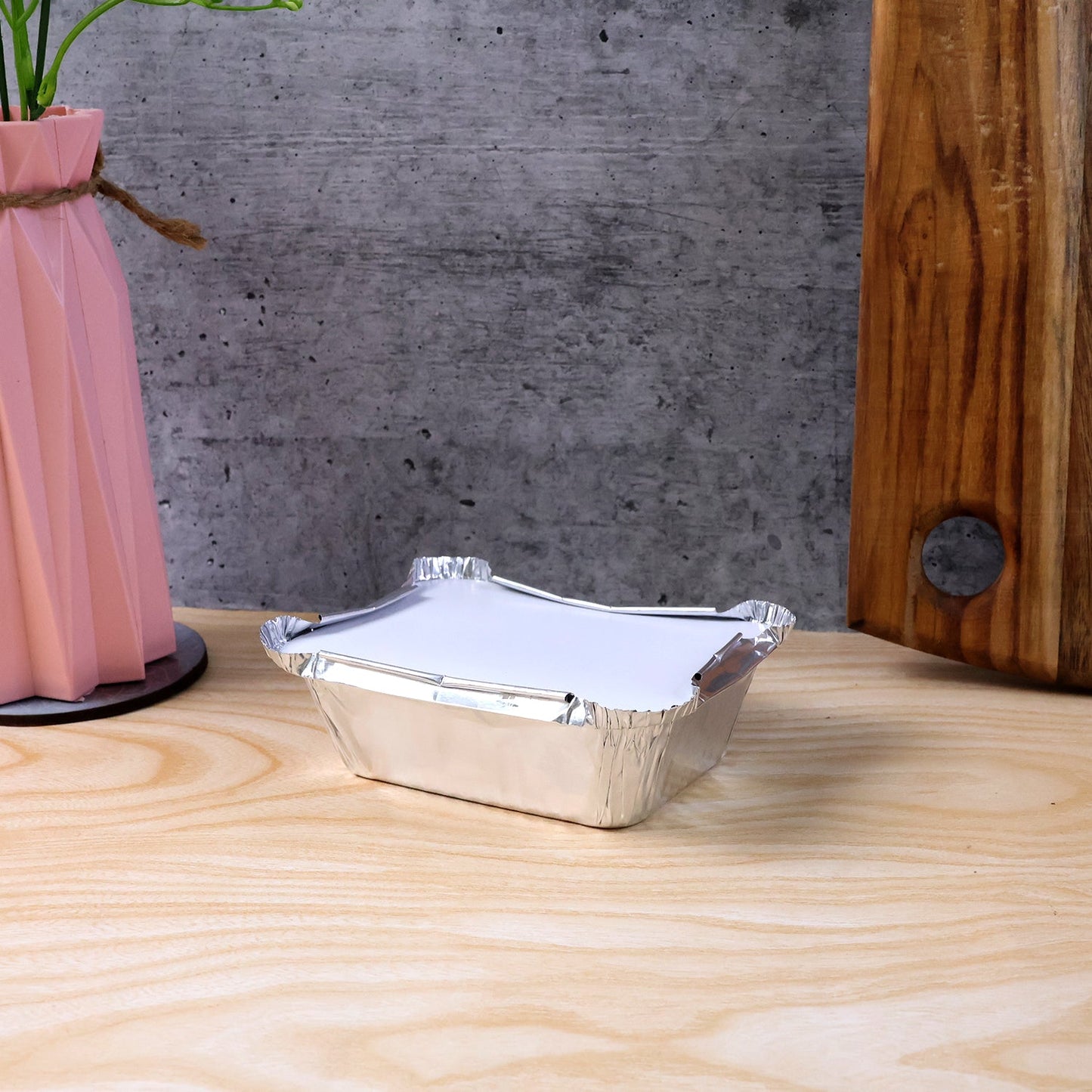 Open disposable aluminium container showing interior space for food