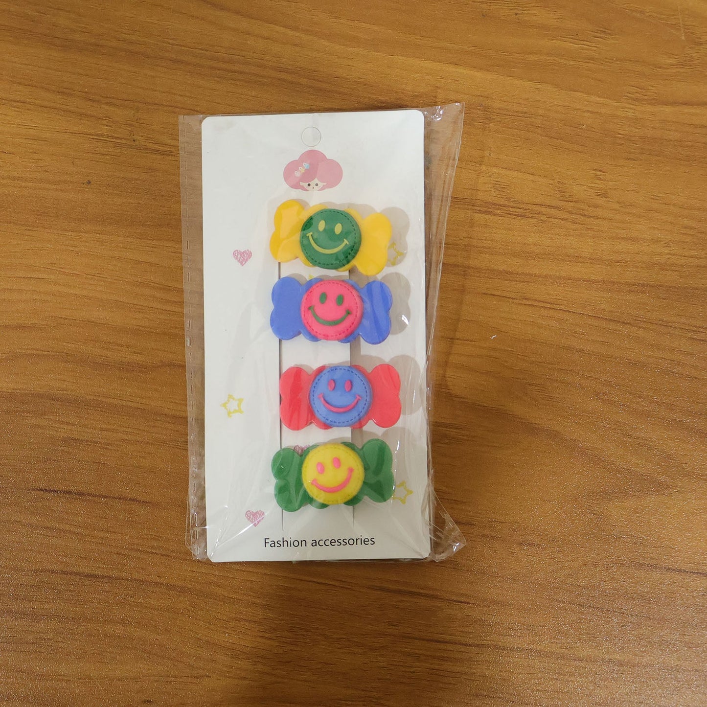 Lifestyle image of colorful smiley candy hair clips worn for casual hair styling
