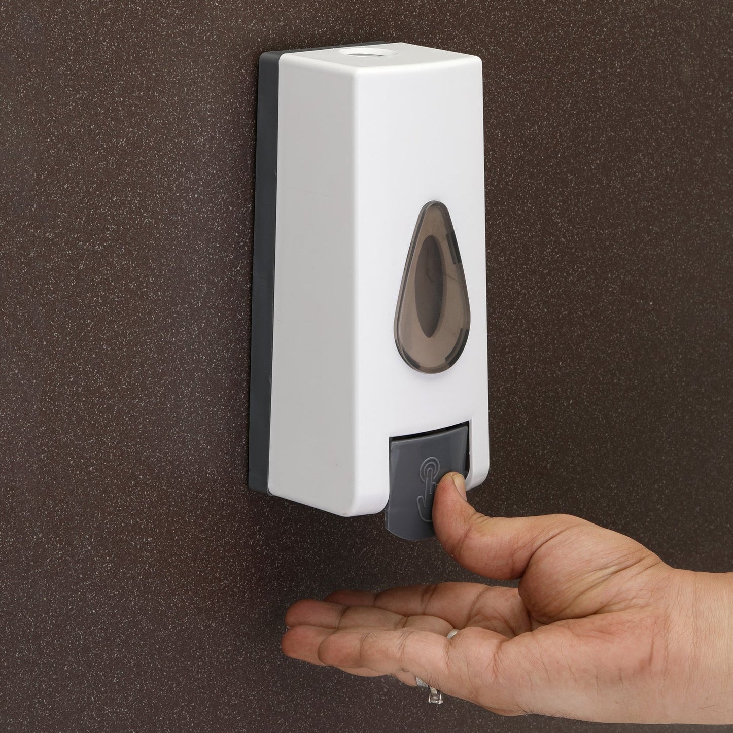 Side angle view of the modern wall mounted soap dispenser design.