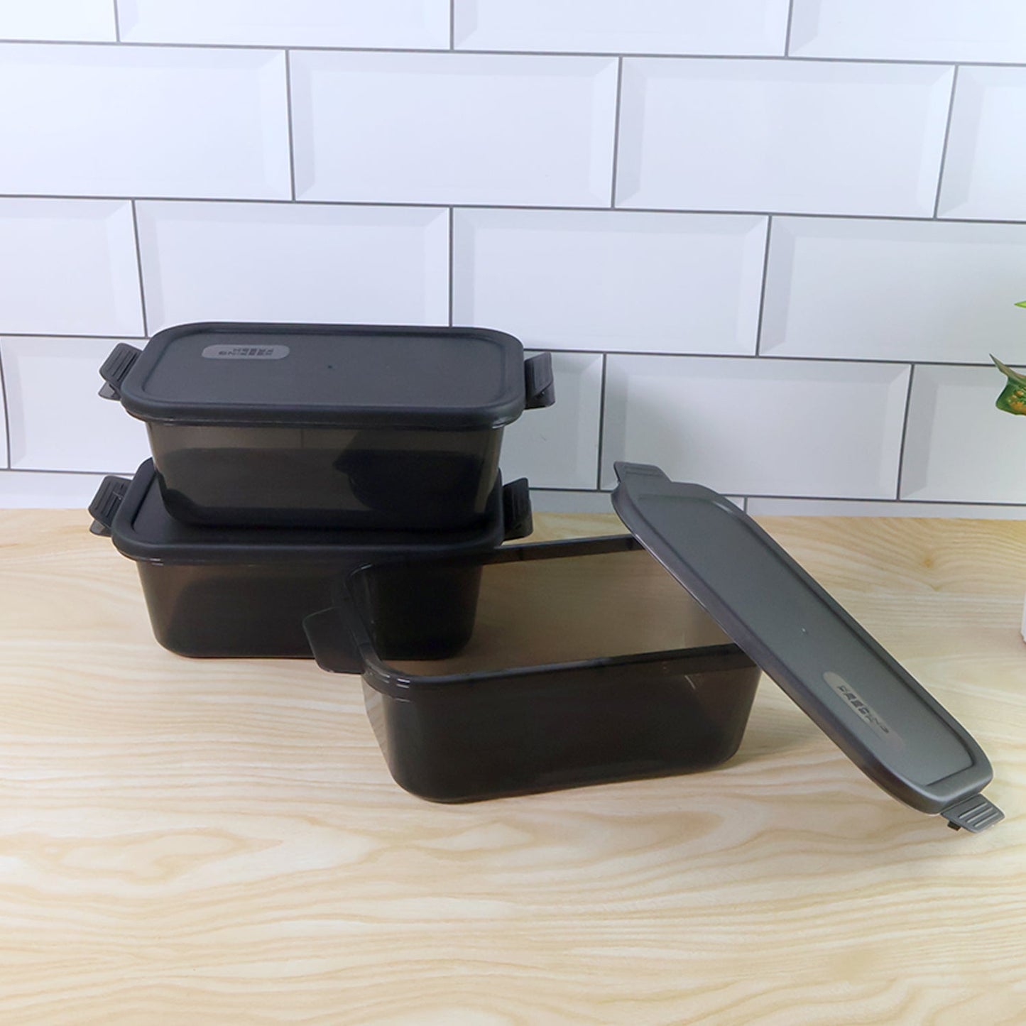 Close-up of a leakproof clip-lock lid on a rectangular food storage container.