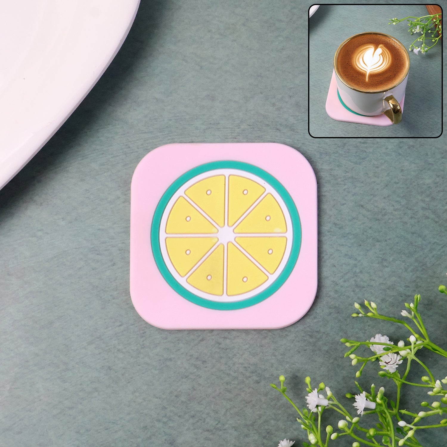 Heat-resistant silicone lemon drink coaster on wooden table