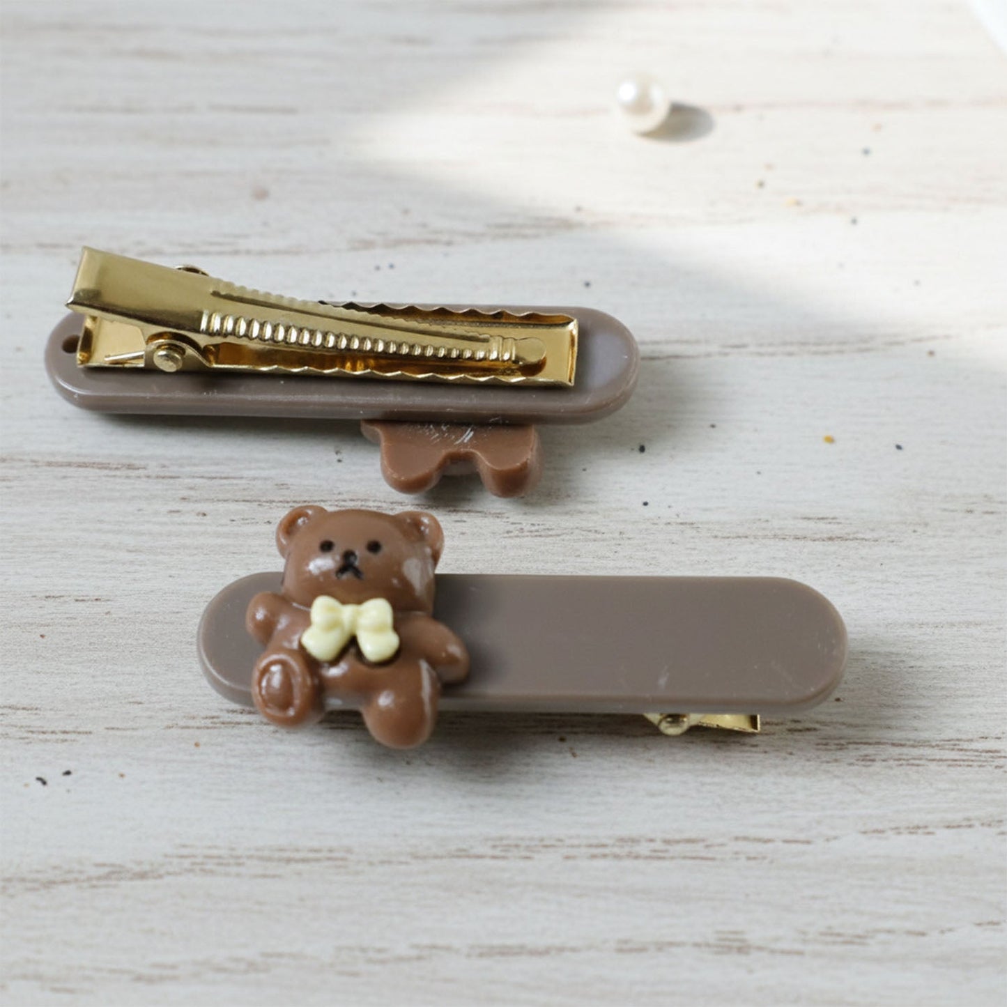 Collection of pastel-toned teddy bear hair clips laid out