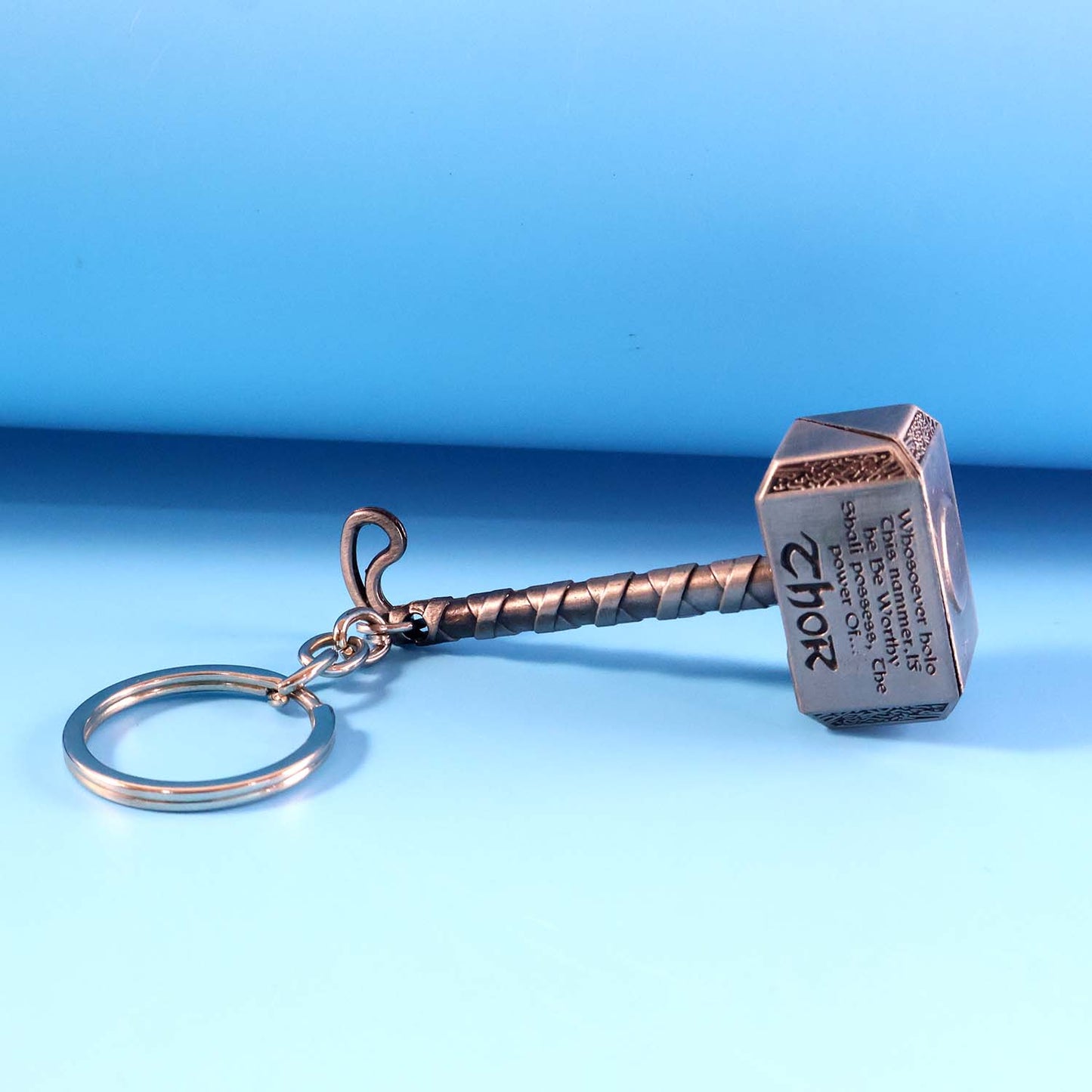 Metal hammer keychain with sturdy metal ring holding keys
