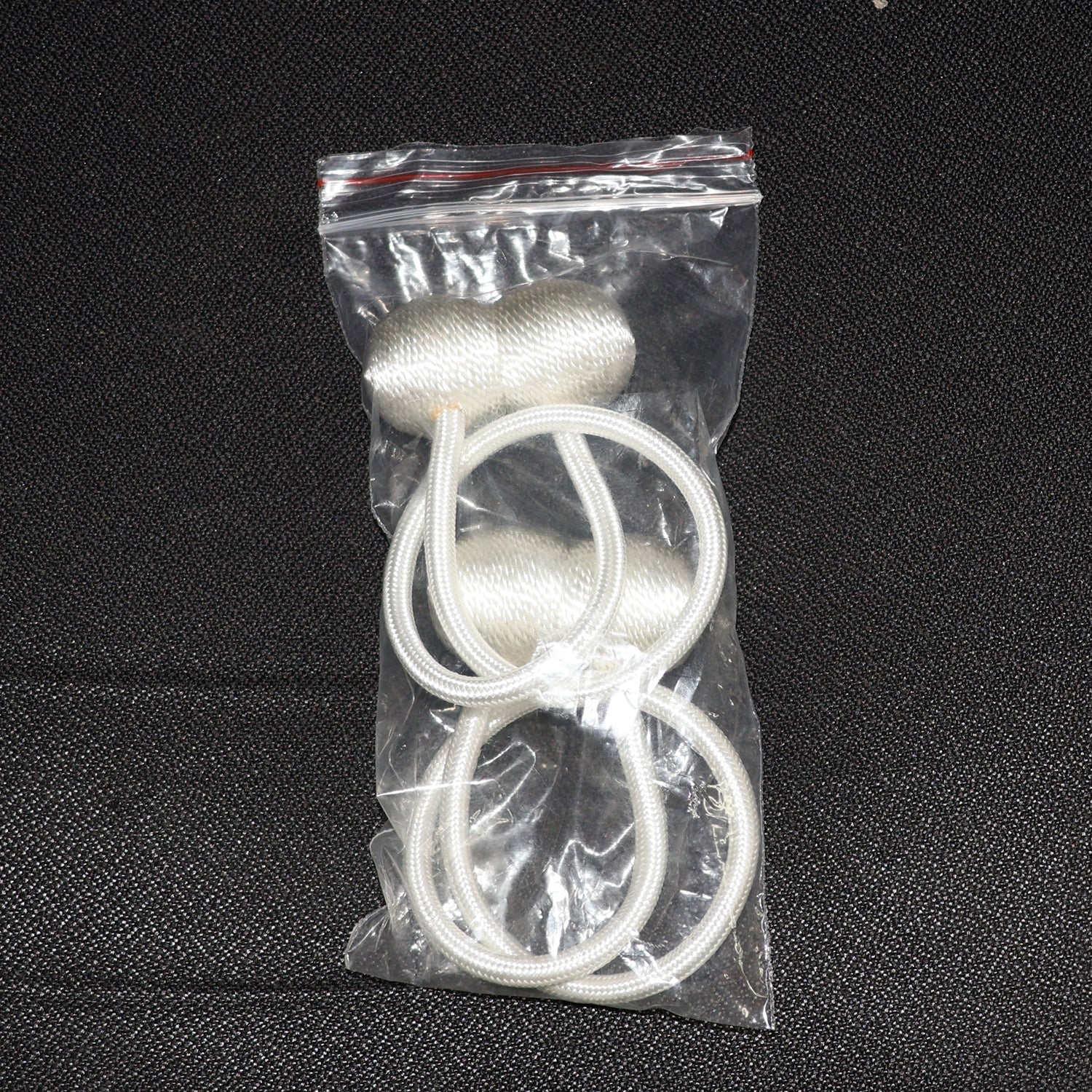Elegant magnetic curtain tiebacks in a home setting, styling a window.