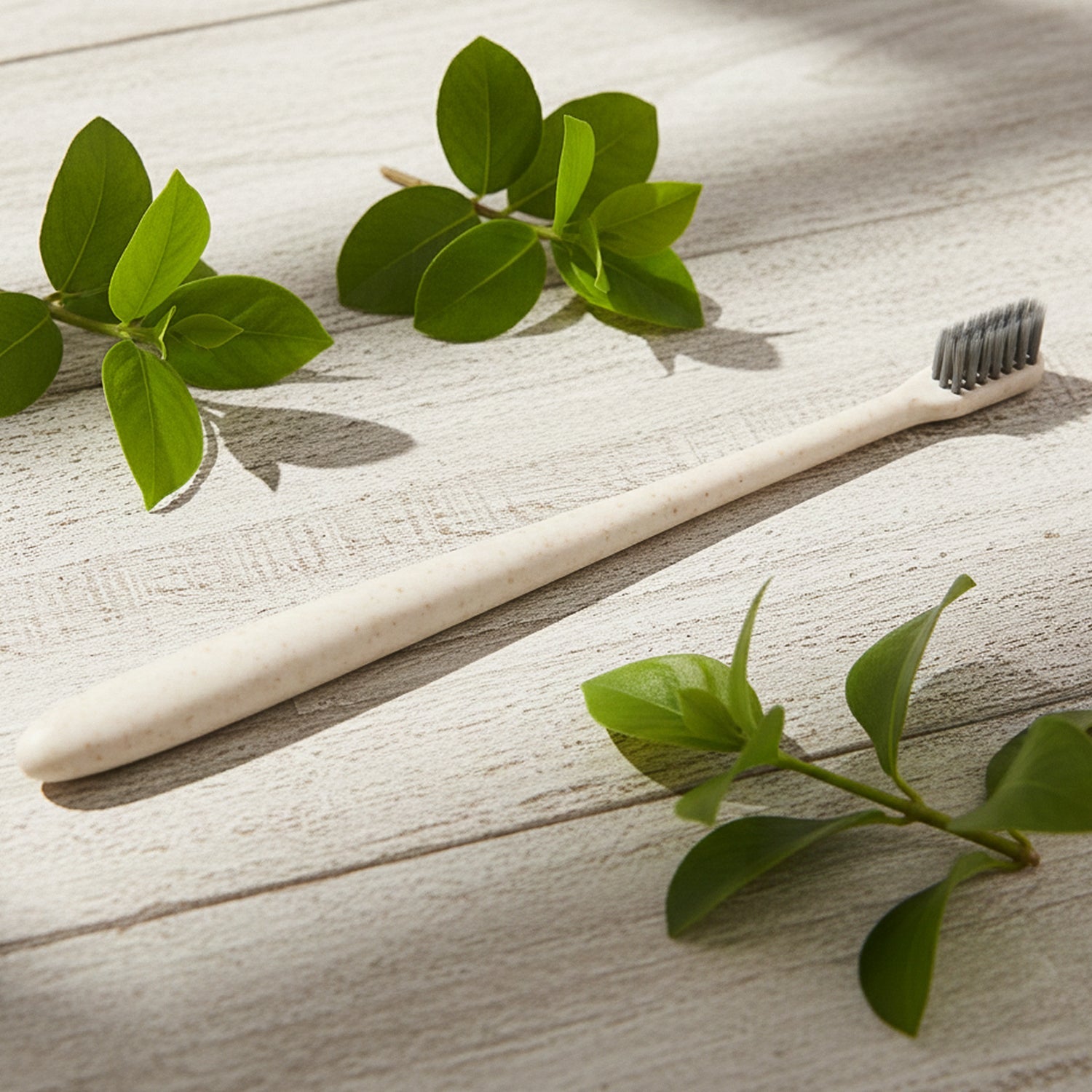 A hand holding the ergonomic MintGuard Soft-bristle Toothbrush for comfortable and precise grip.