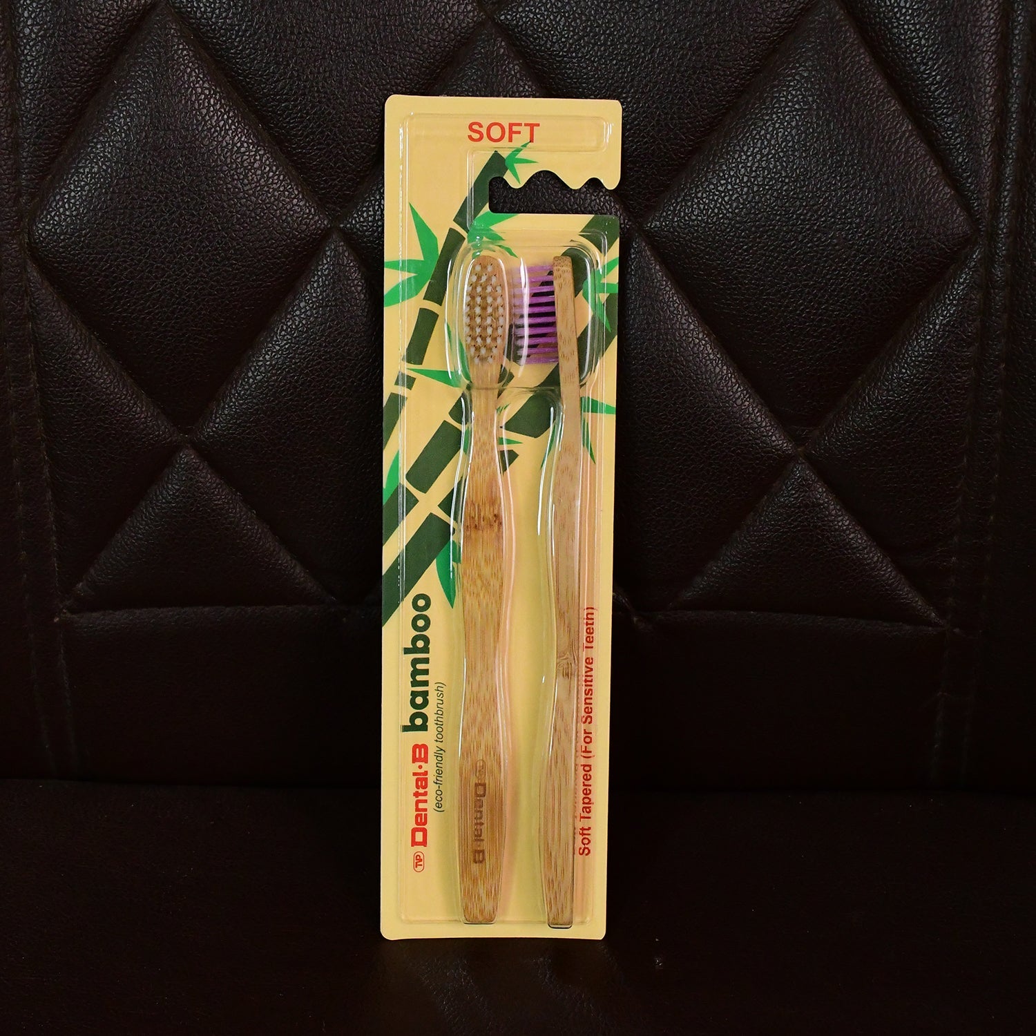 Angled view highlighting bamboo toothbrush with medium bristles