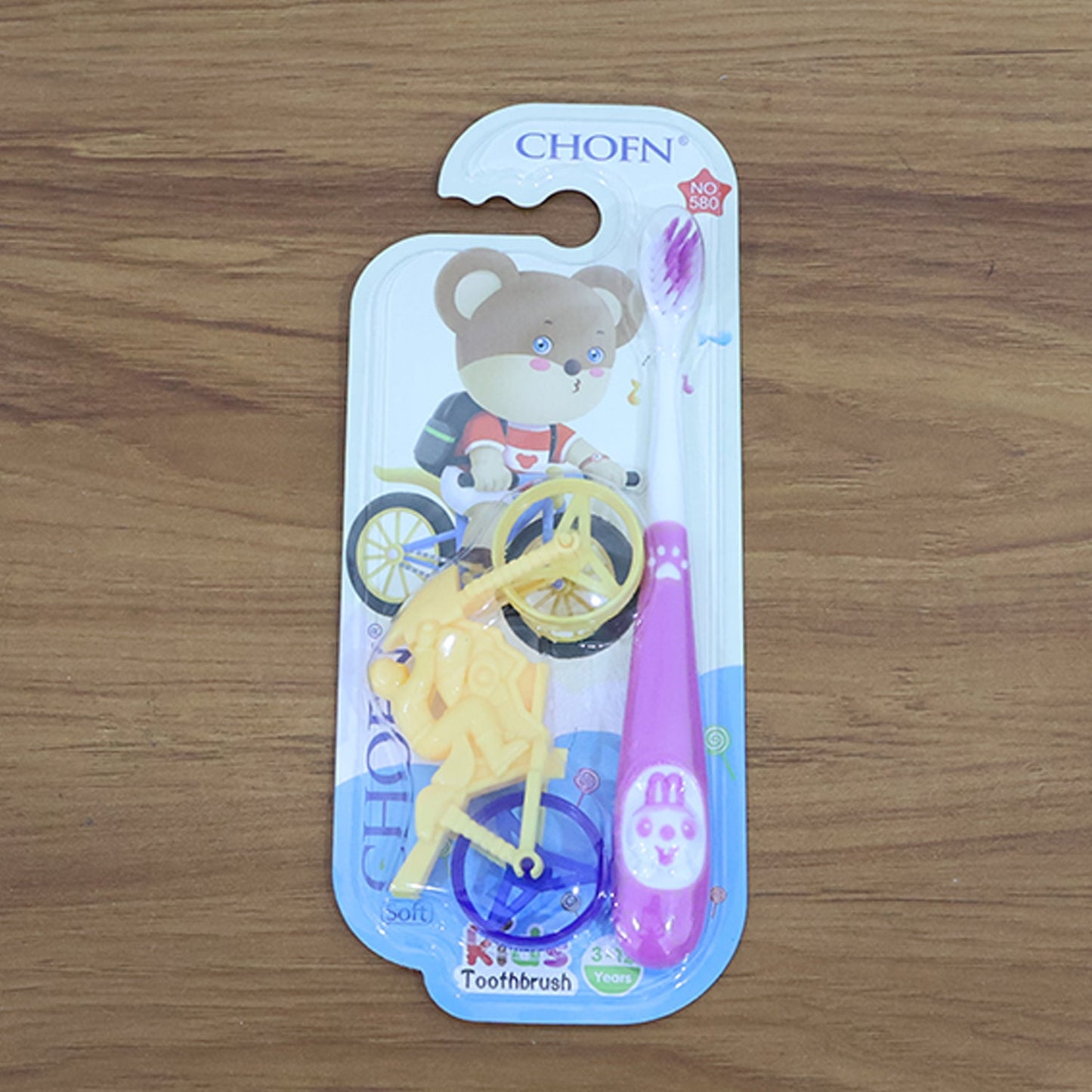 Complete kids oral care set with panda toothbrush and motorcycle toy