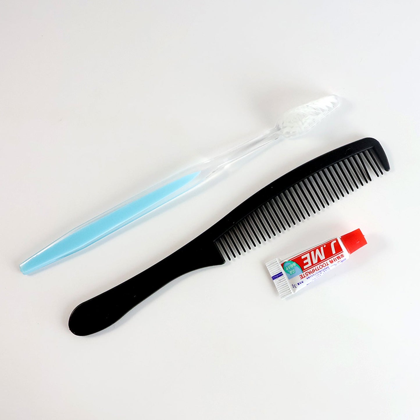 Mini travel hygiene kit featuring toothbrush and comb for quick grooming