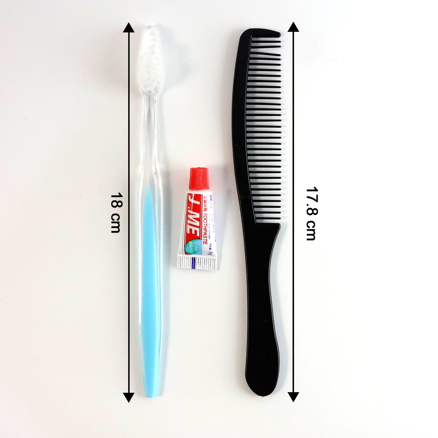Toothbrush, toothpaste, and comb neatly packed in a travel hygiene kit