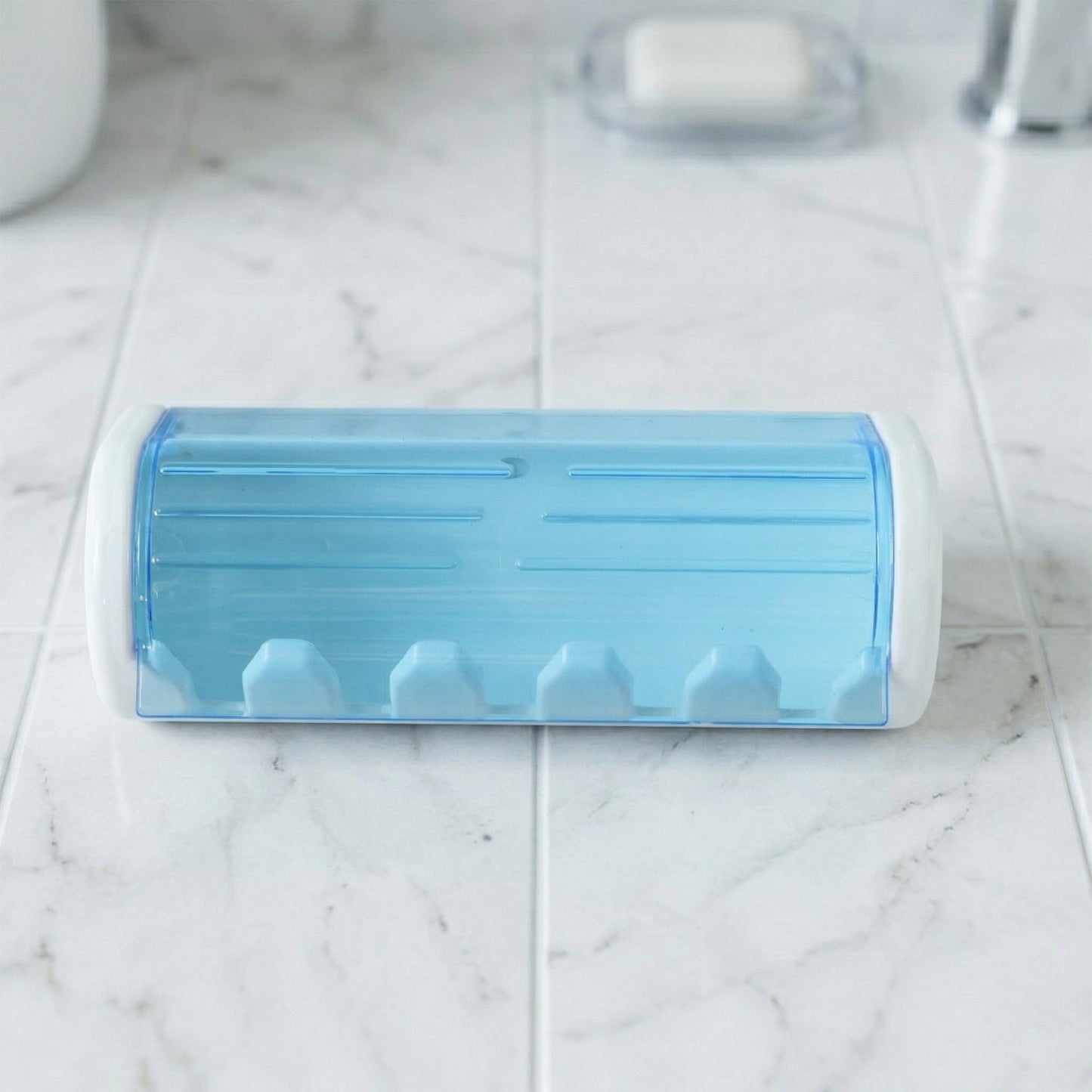 Front view of wall mounted protective toothbrush holder