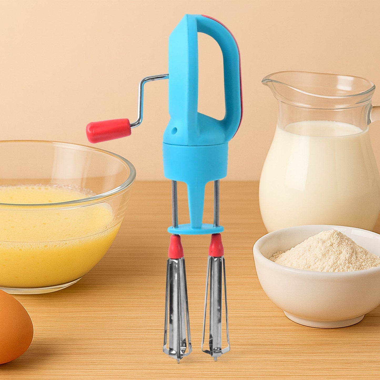 Manual hand beater showing ergonomic handle and gear mechanism