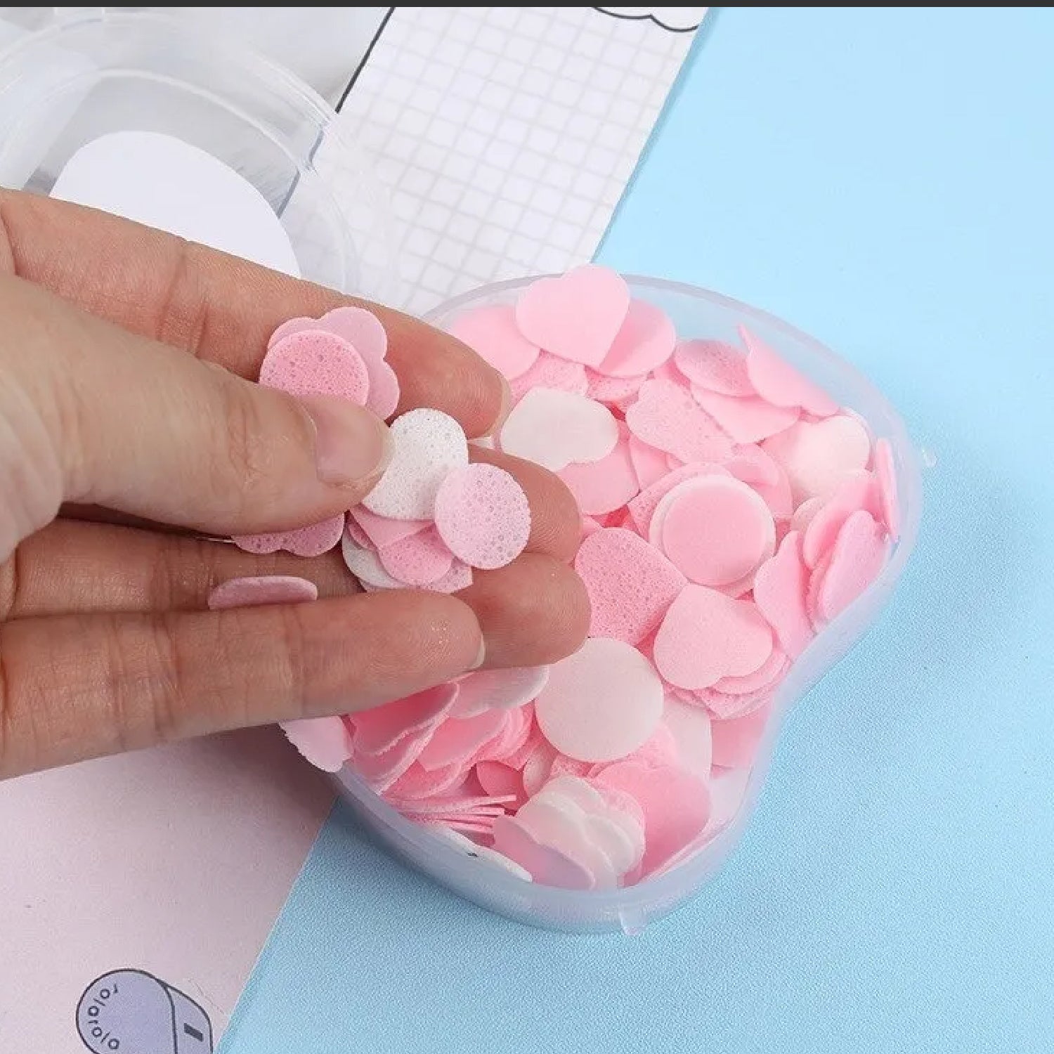 Apple design paper soap dissolving in water, creating a rich lather.