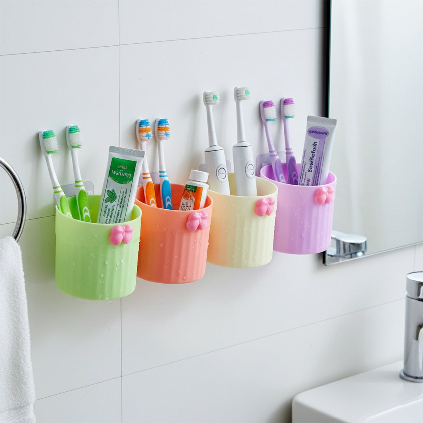 Close-up of wall mount brush holder keeping toothbrushes hygienic