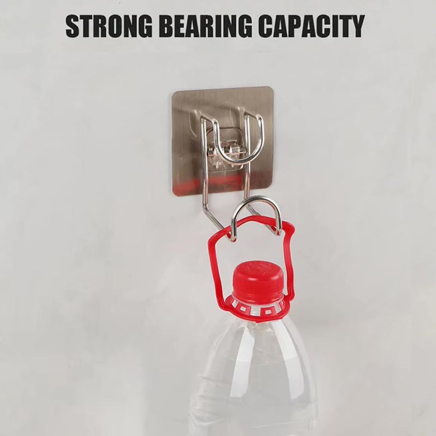 Kitchen towel neatly hung on a transparent adhesive wall hook for easy access.