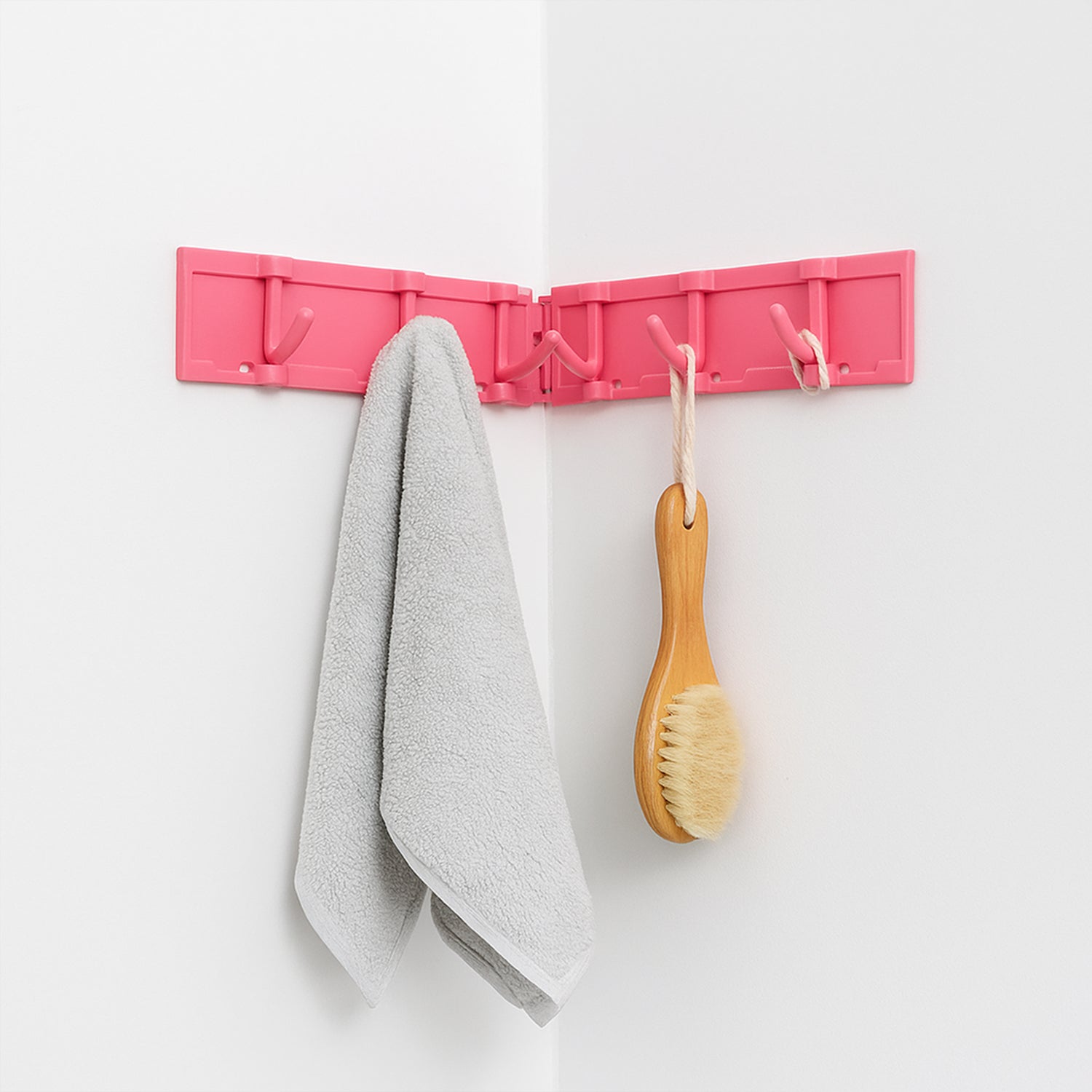 Compact wall-mounted hook rack organizer ideal for towels and accessories