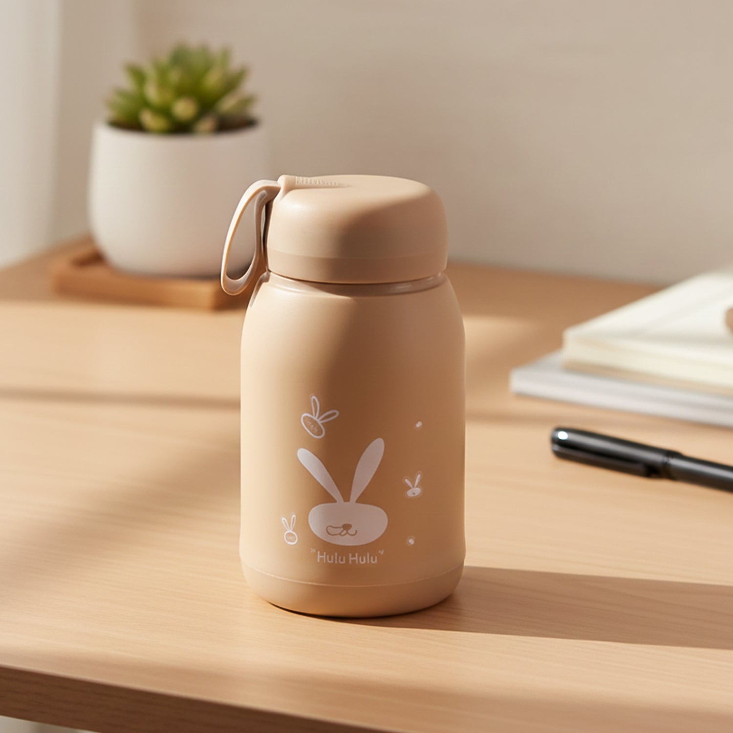 Bunny print glass water bottle with leak-resistant lid and carry loop