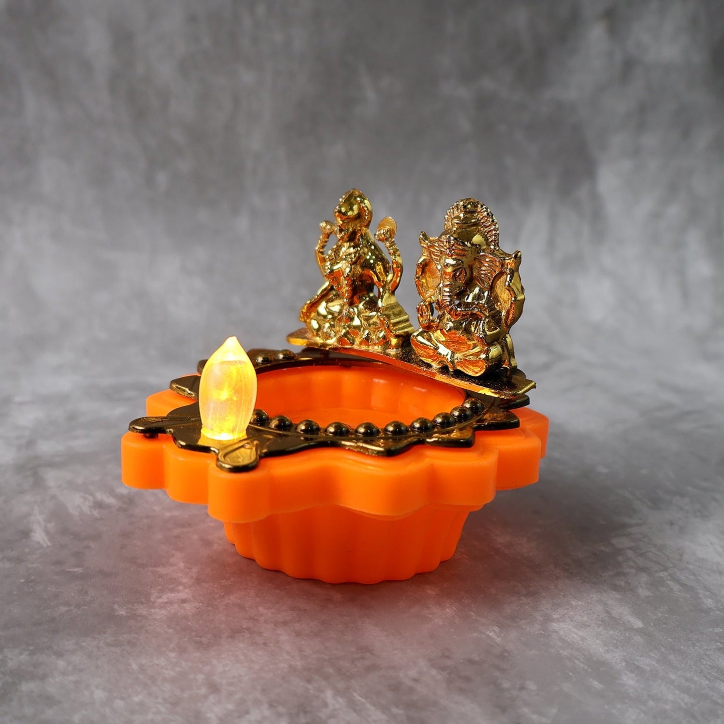 Festive water sensor electric diya with Laxmi Ganesh idols for pooja