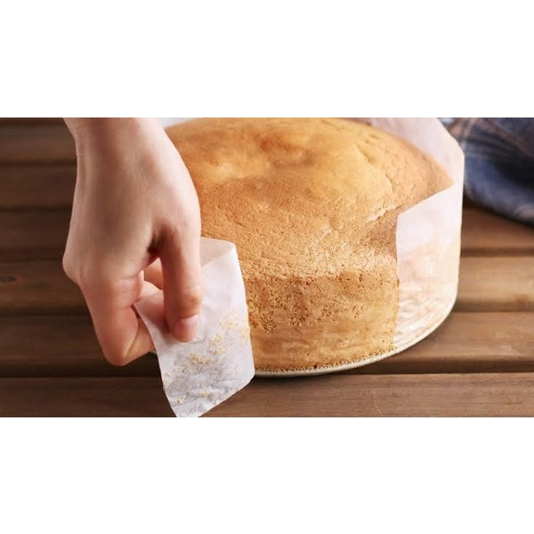 Unused roll of non-stick baking paper, perfect for home bakers and cooks.