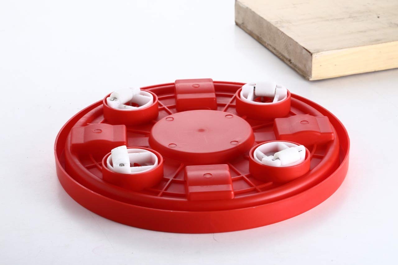Red gas cylinder stand with movable wheels for effortless kitchen mobility.