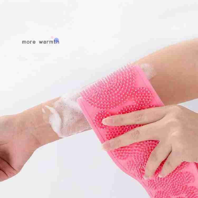 Person using the silicone back scrubber for a deep and relaxing shower.