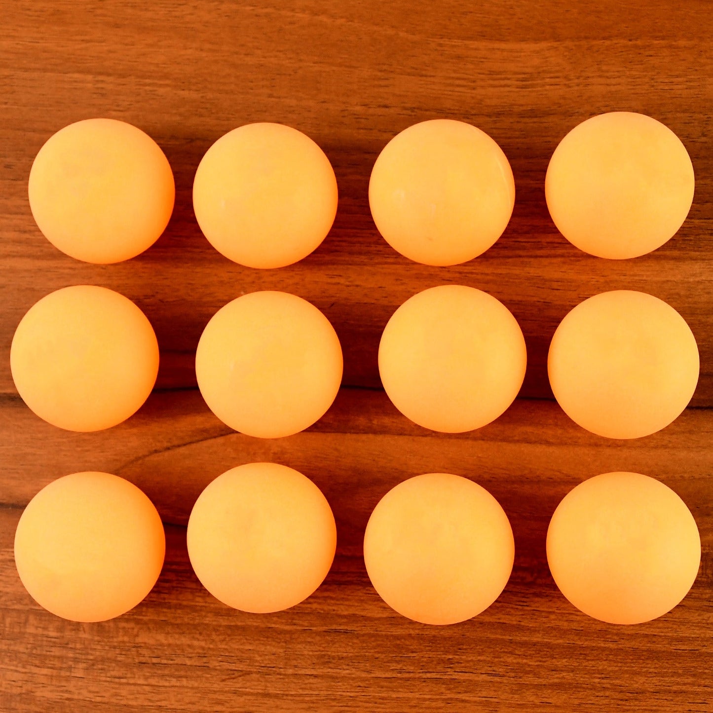 Orange table tennis balls ideal for training and tournament use displayed