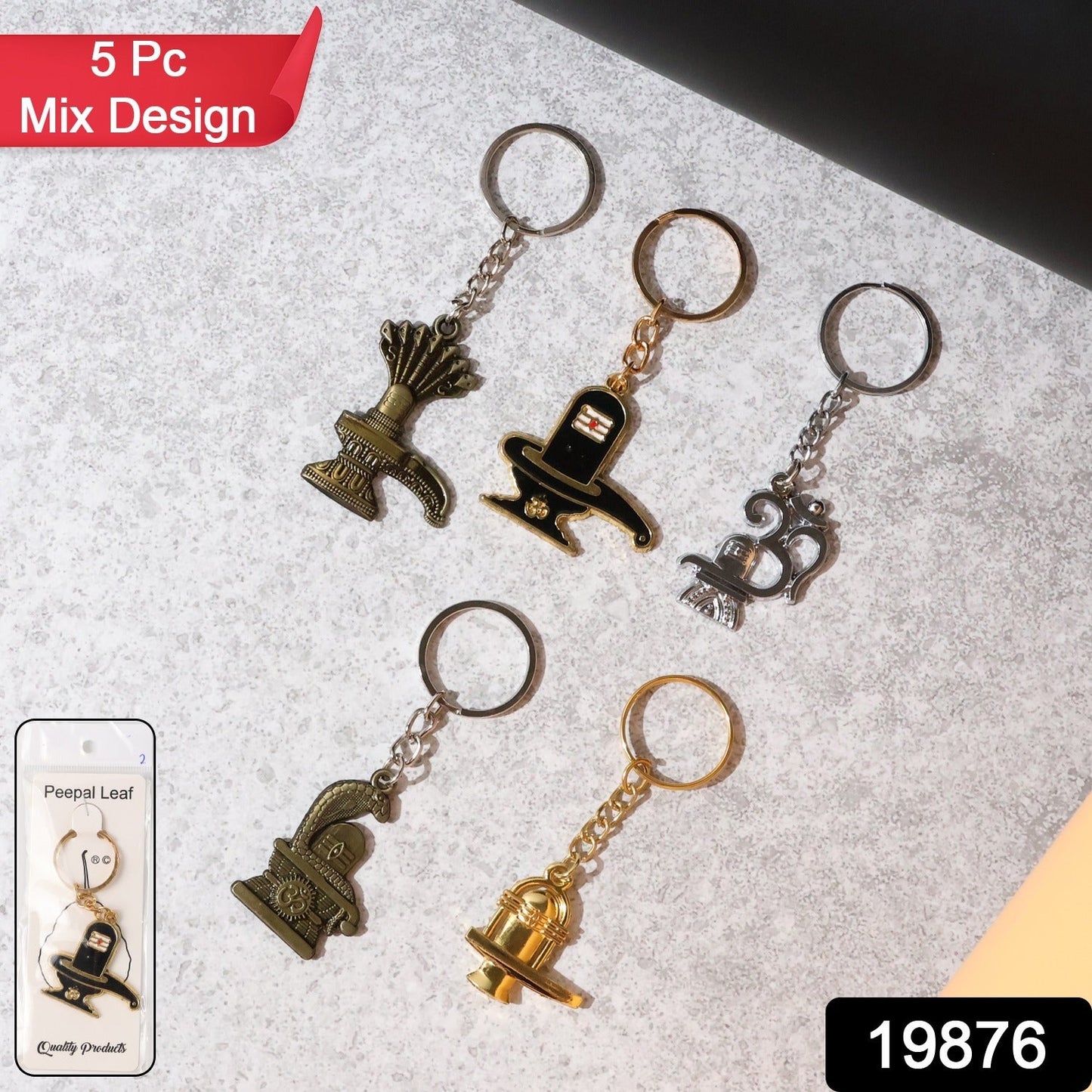 Close-up of Trishul design metal keychain from set