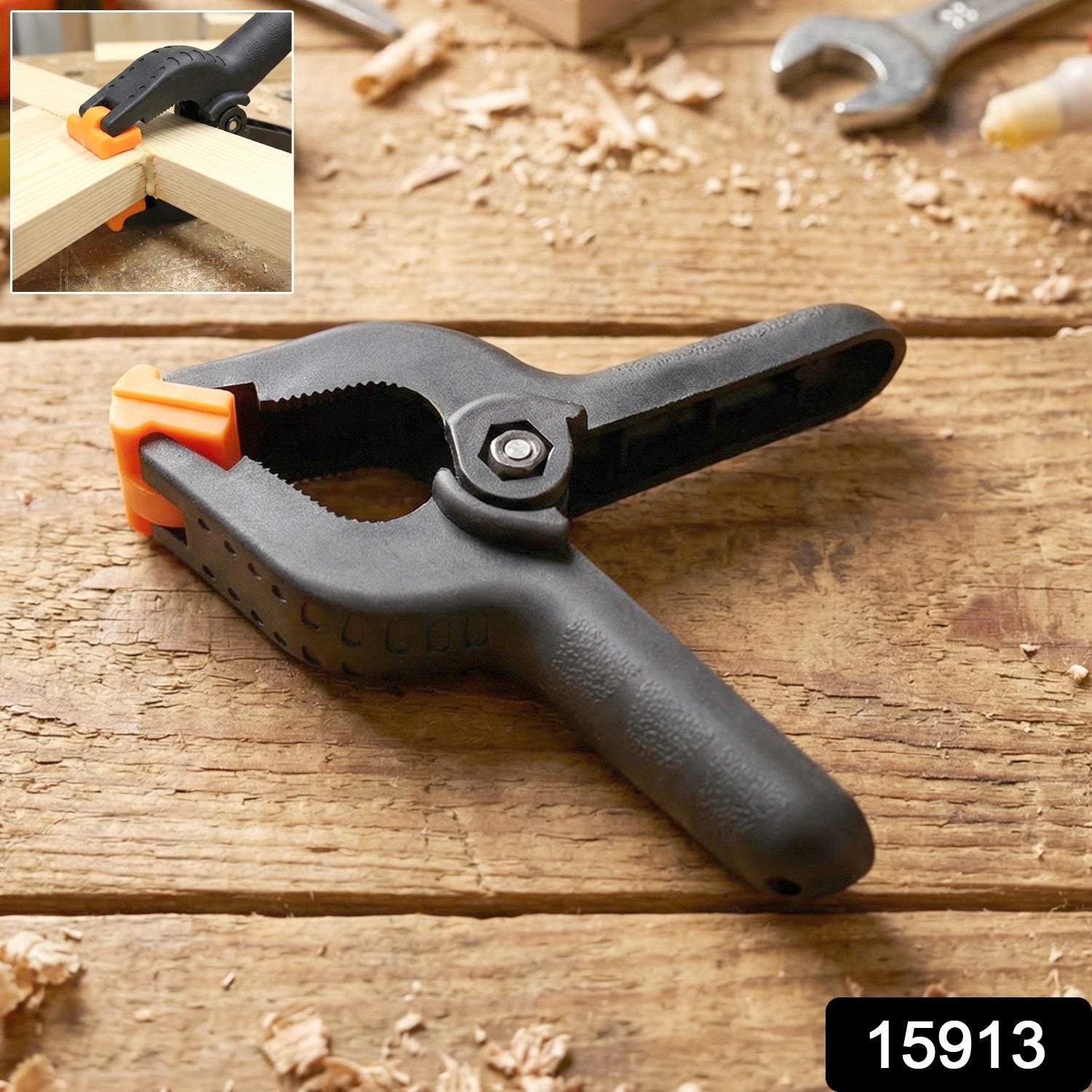 Close-up of a heavy duty spring clamp holding materials firmly