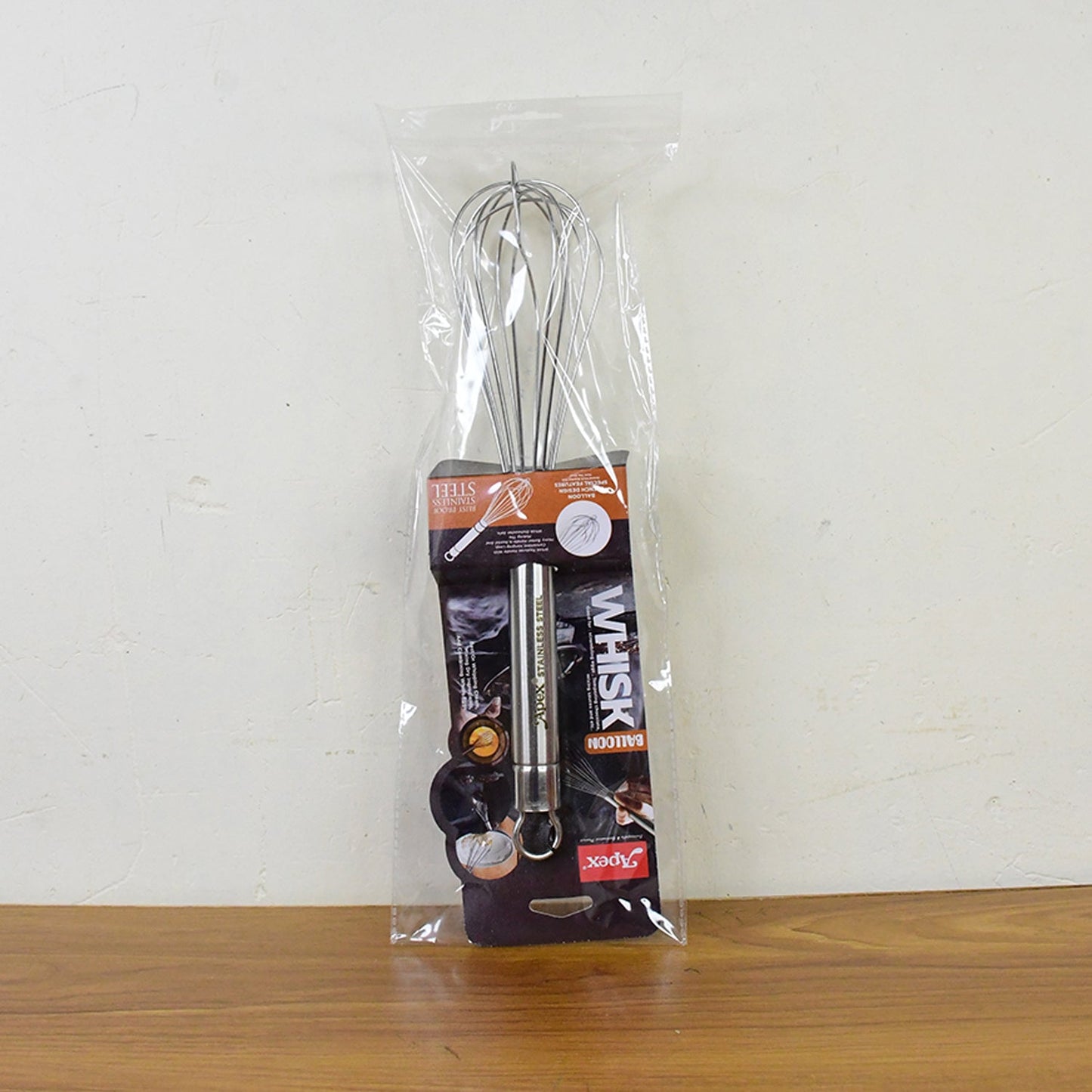 Large stainless steel hand whisk with hanging loop for storage