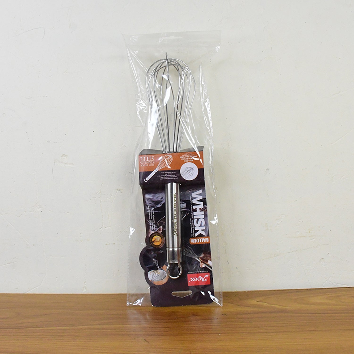 Large stainless steel hand whisk with hanging loop for storage