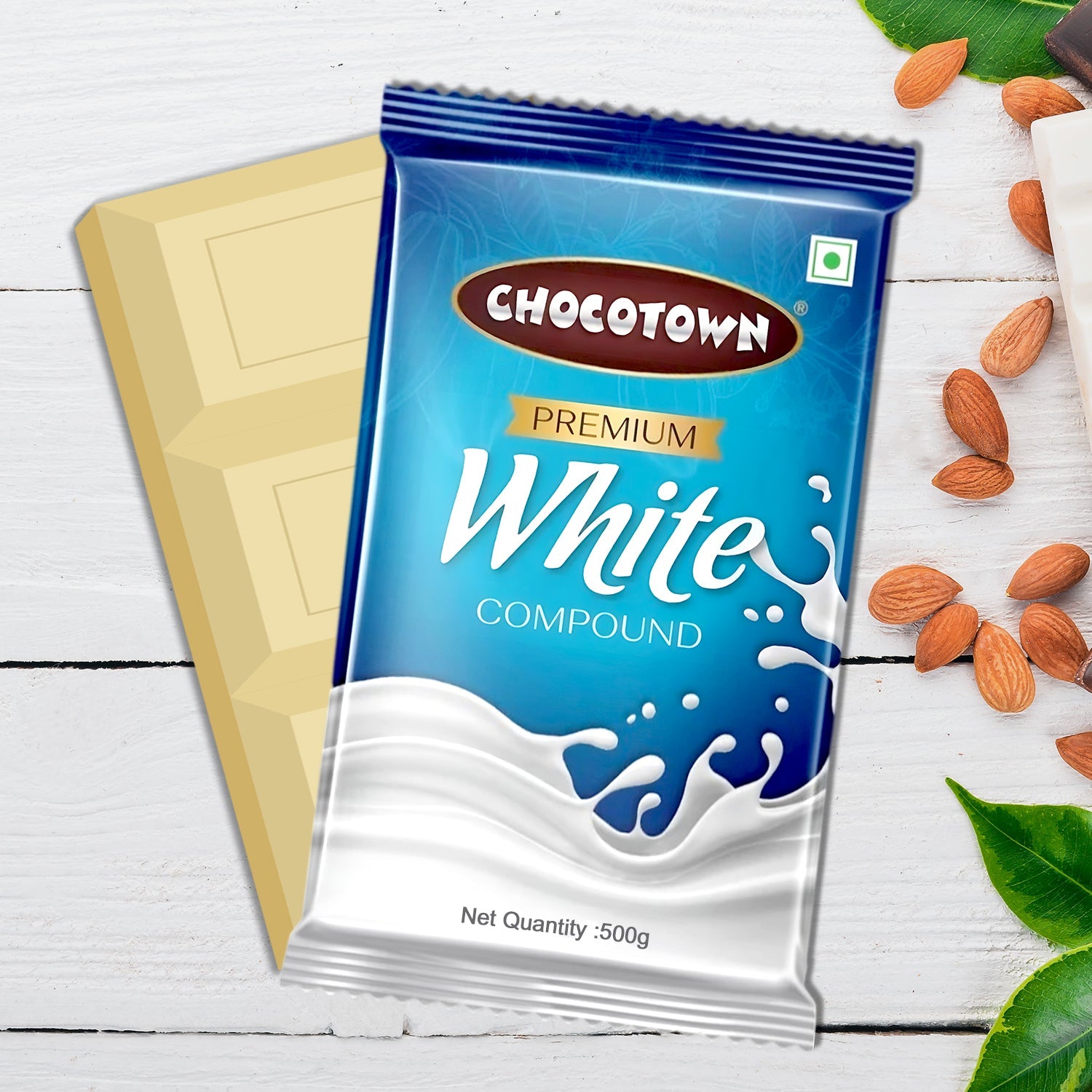 Pieces of Chocotown White Compound Chocolate broken from the slab, showing its smooth texture.