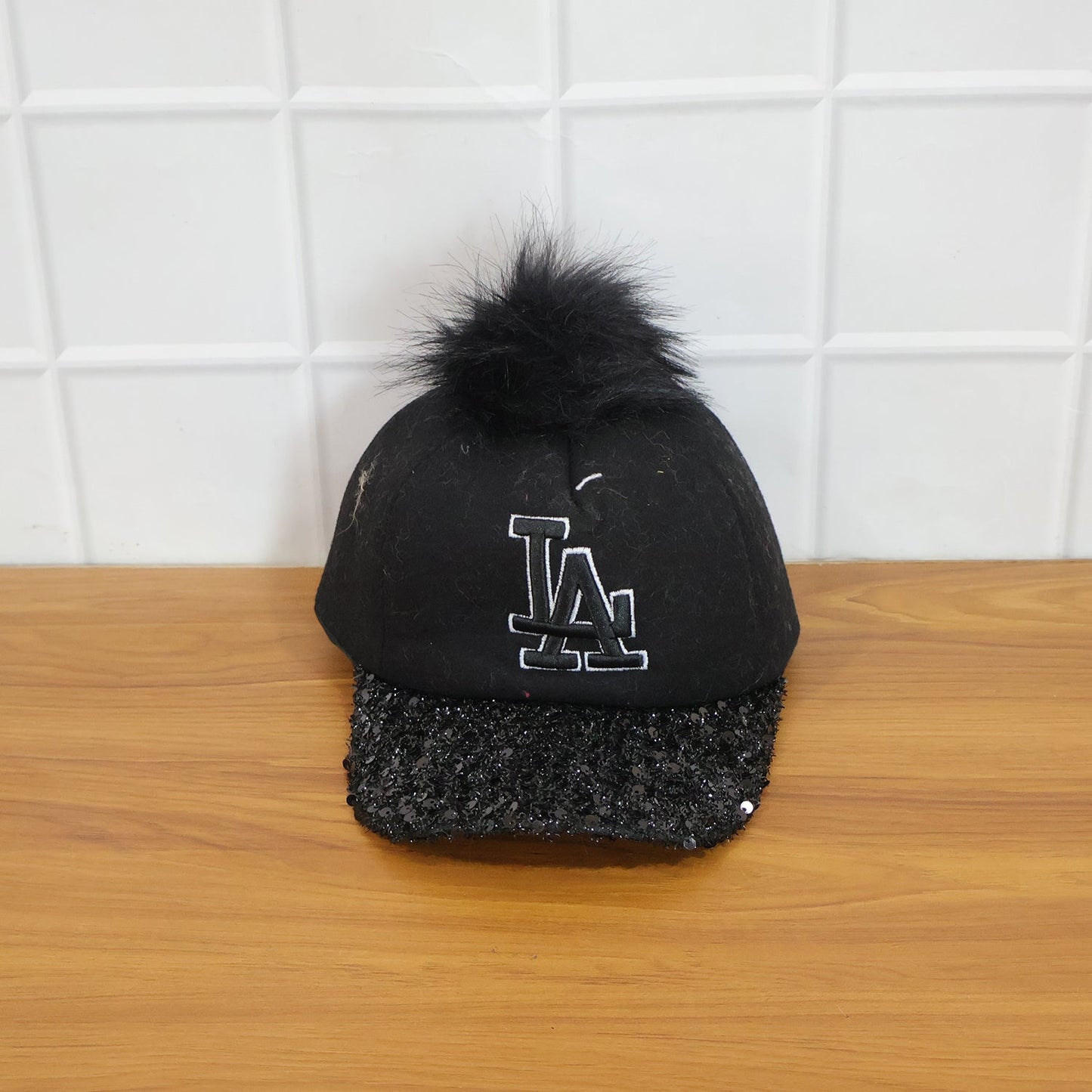 Close-up of glitter brim on stylish baseball cap