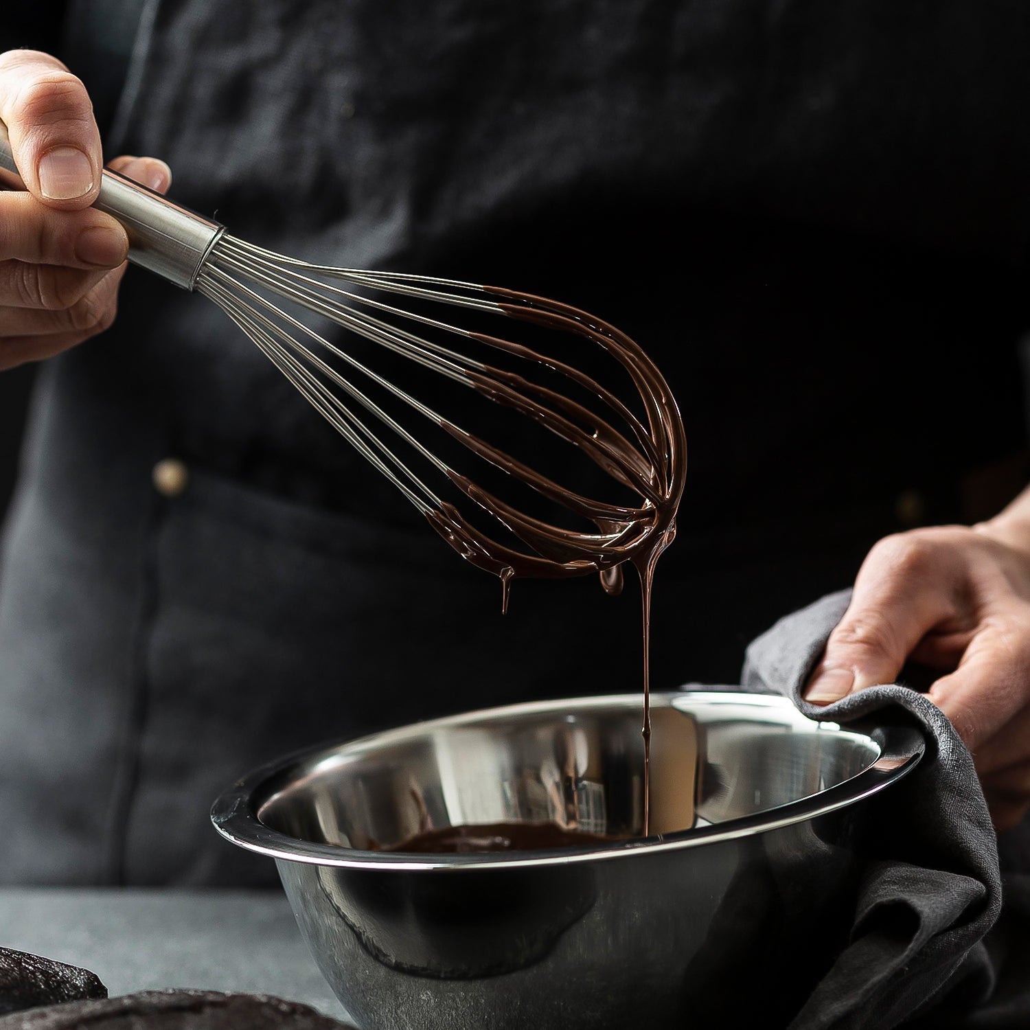 Handle of small stainless steel balloon whisk with hanging loop