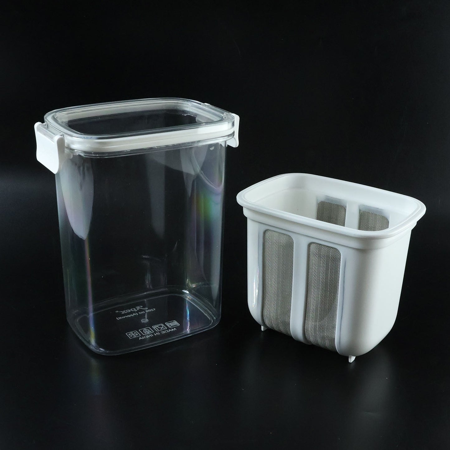 Complete yogurt maker set with strainer basket and lid ready for use.