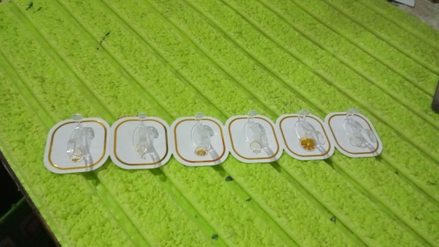 Multiple transparent adhesive hooks used to organize various items in a modern home setting.