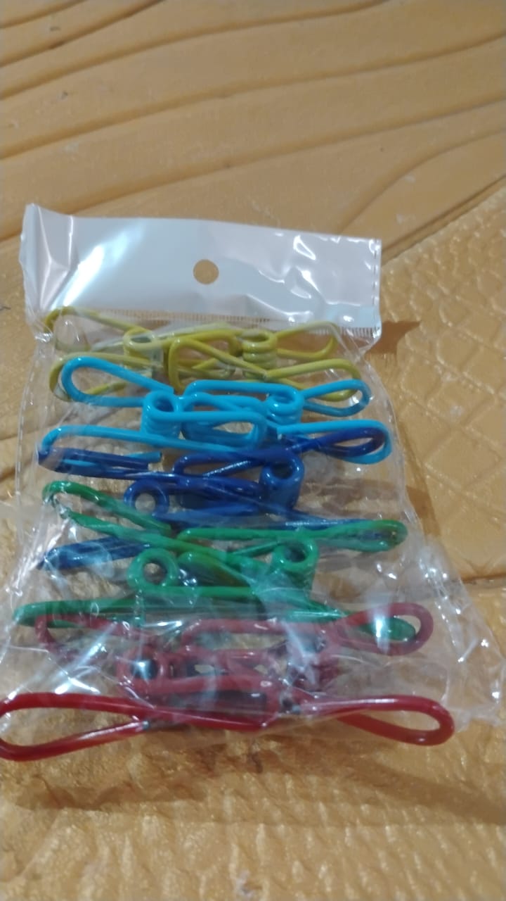 Various uses for metal clothes pins clips including craft projects and photo display
