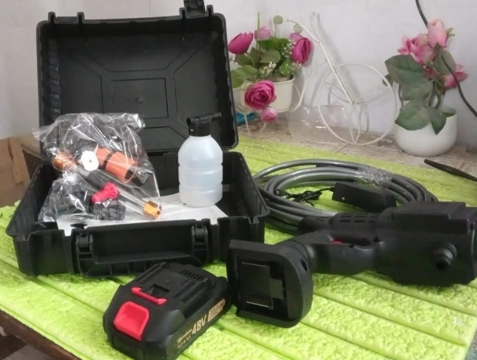 The wireless high-pressure spray gun ready for effective bike washing.