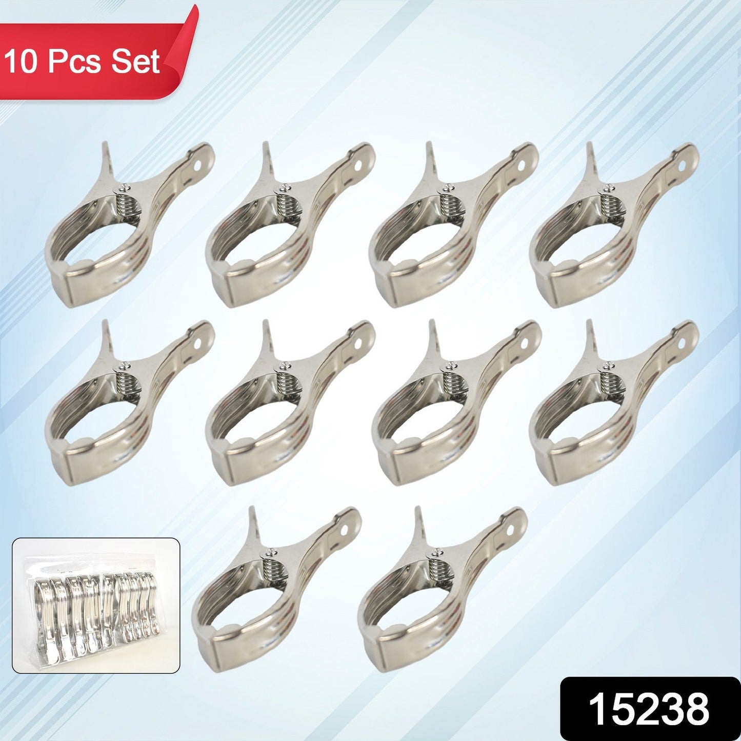 Close-up of stainless steel beach towel clip gripping fabric securely.