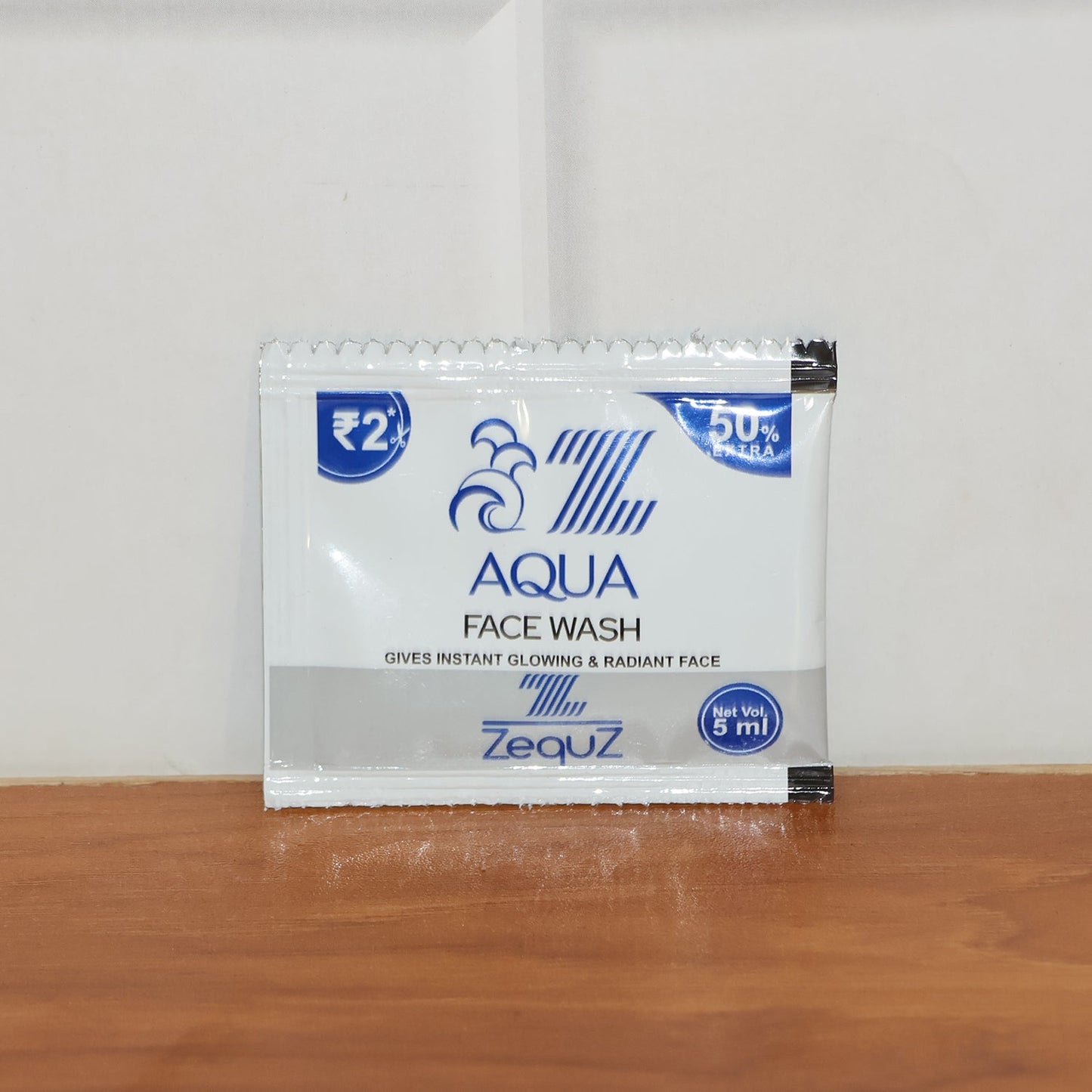 Zequz Aqua Face Wash sachet displayed with fresh, clean skin results.
