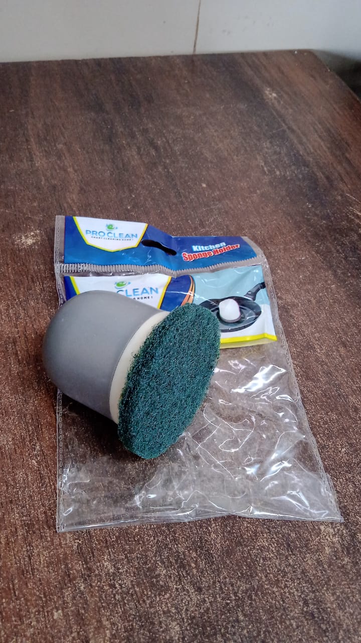 Kitchen scrubber removing burnt grease and food stains effectively
