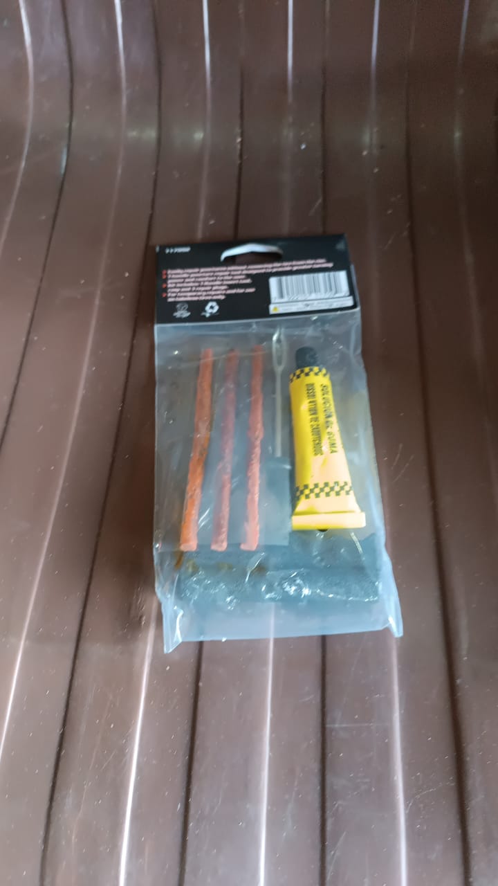 The complete tubeless tyre puncture repair kit shown in its retail packaging.