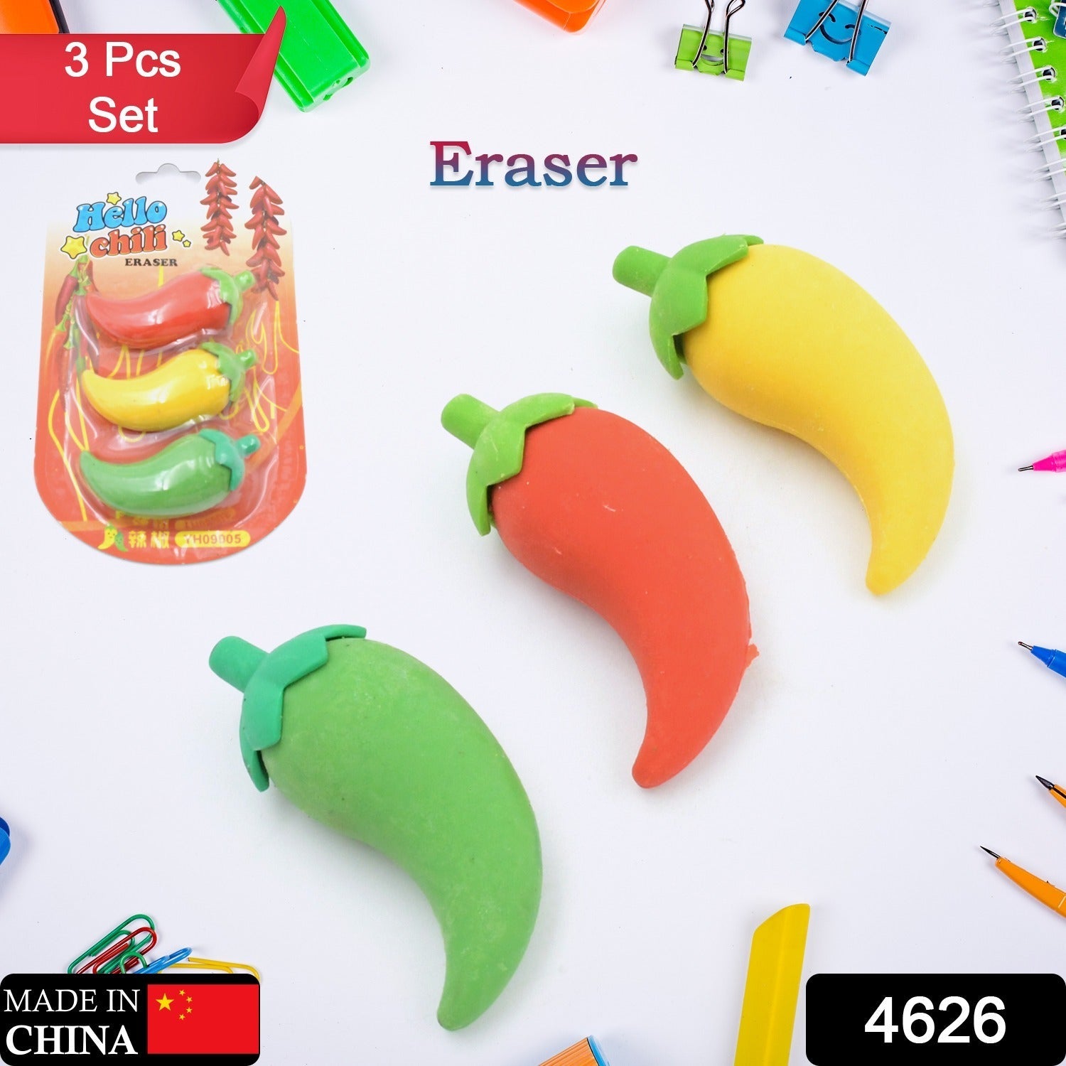 A child's hand holding a red chili shape eraser, showing its compact size.